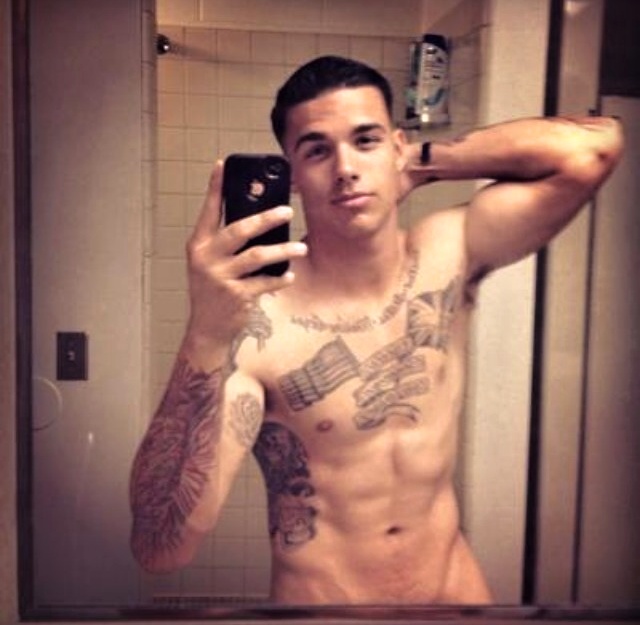 Guy with Tattoos make nude Self Shots and presents his cut and cock boner on cam